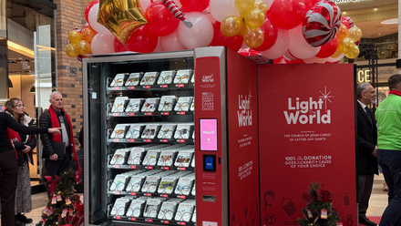 People donating to Light the World vending machine at Touchwood.jpeg